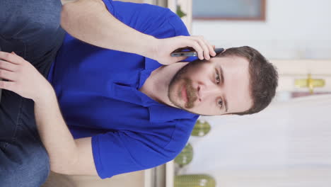 Vertical-video-of-The-man-who-got-bad-news-on-the-phone.